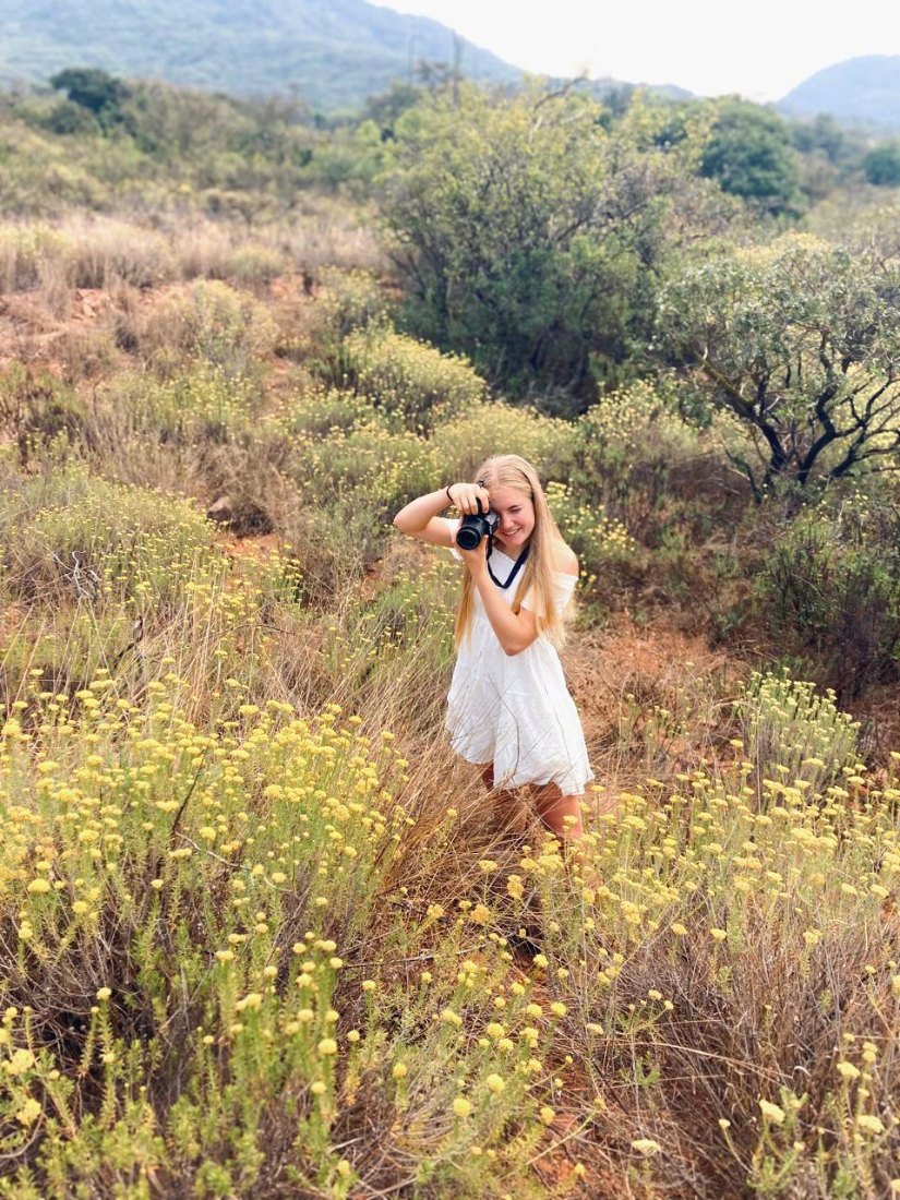 Marike, Founder of Kiekie, photographing on the farm